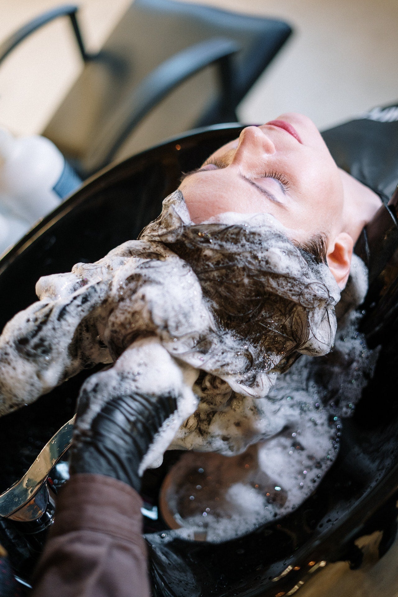 Woman receiving a hair care routine
