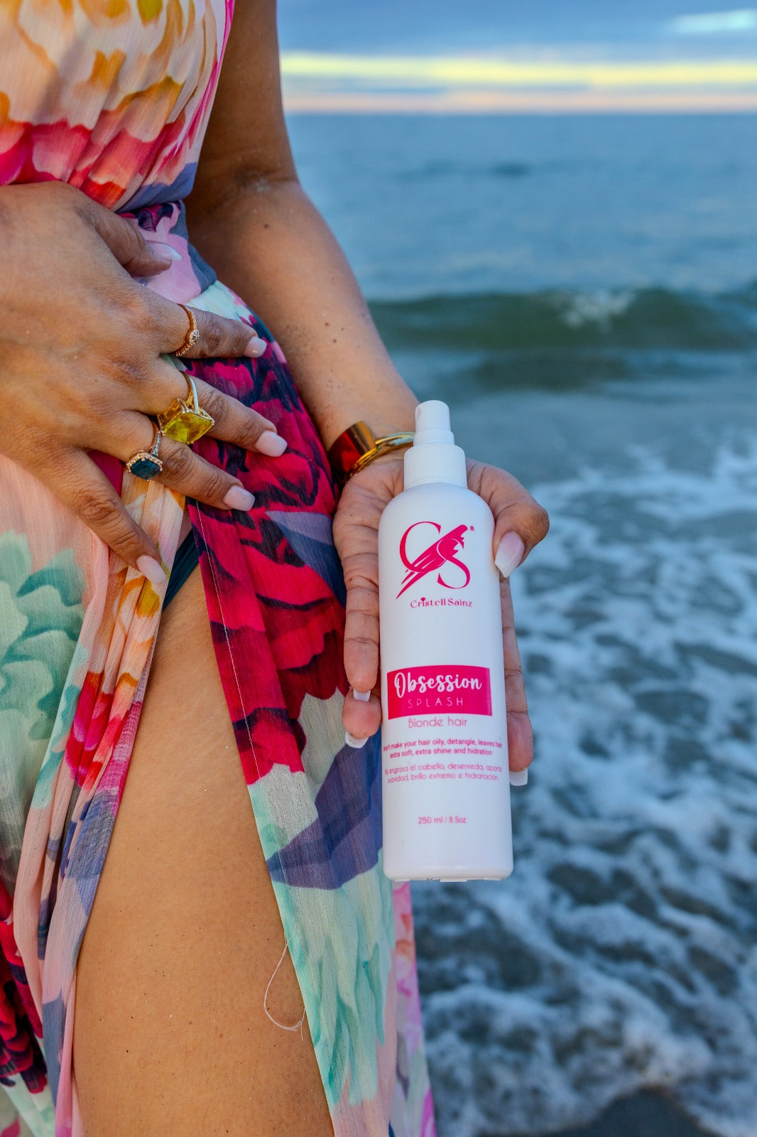 A model showing one of the Secrets Hair Products called Obsession Splash