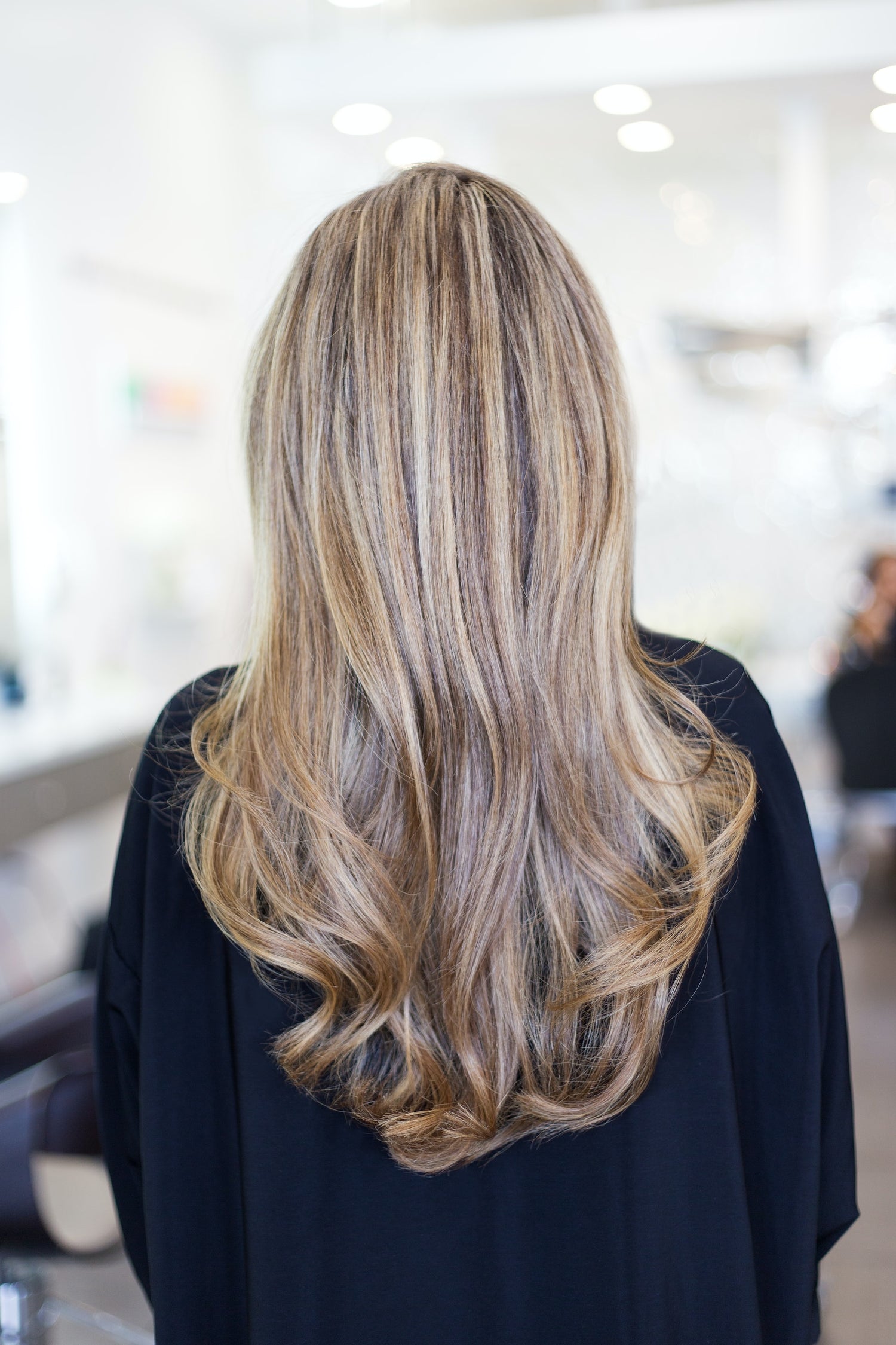 Woman with perfect hair in a hair salon